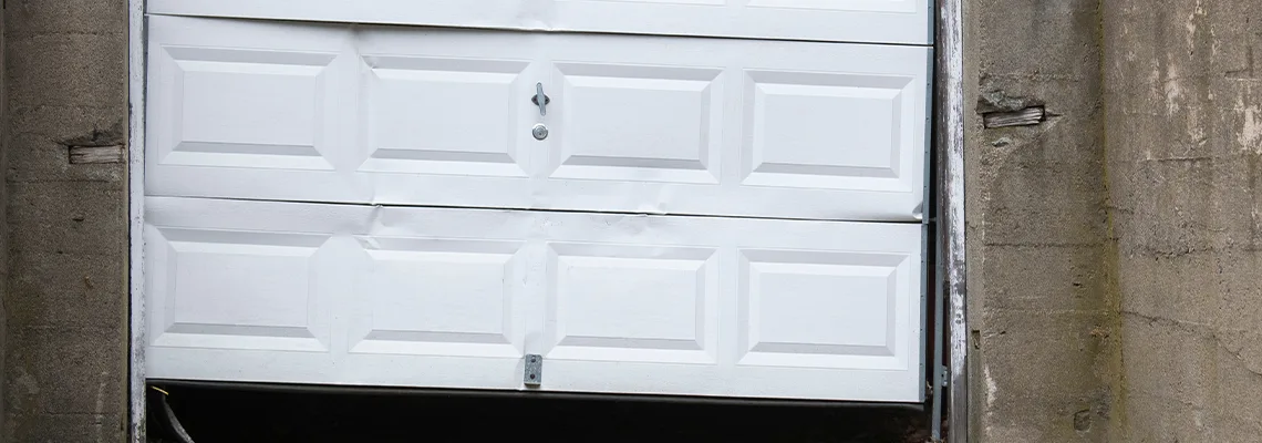 Garage Door Got Hit By A Car Dent Removal in Hamilton, ON